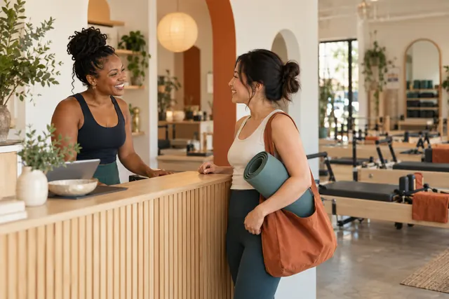 A pilates studio welcoming a member.